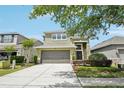 Beautiful two-story home with a well-manicured lawn and inviting two-car garage at 2850 Pewter Mist Ct, Oviedo, FL 32765