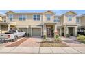 Inviting townhome featuring a private garage and charming front landscaping, showcasing a comfortable and appealing exterior at 3813 Black Spruce Ln, Winter Springs, FL 32708