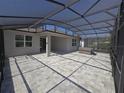 Large screened lanai features brick pavers and overhead coverage at 6129 Citrus Grove Ct, St Cloud, FL 34771