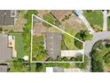 An overhead view of a well-maintained property with lush landscaping, a screened-in patio, and a defined property line at 619 Byron Rd, Winter Park, FL 32792