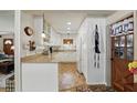 Well-lit kitchen featuring white cabinets and ample counter space, providing a clean and functional cooking area at 619 Byron Rd, Winter Park, FL 32792