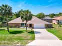 Beautiful single-story home with a large driveway, two-car garage, and well-kept lawn at 1233 Gladstone Dr, Deltona, FL 32725