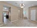 Open living space showcasing seamless transition to kitchen, enhancing flow and natural light at 12335 Cruxbury Dr, Windermere, FL 34786