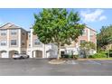 Attractive condo building with attached garages and accessible parking spaces at 12837 Madison Pointe Cir # 206, Orlando, FL 32821
