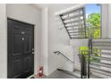 Well-lit exterior stairwell leading to the unit entrance at 12837 Madison Pointe Cir # 206, Orlando, FL 32821