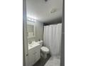 Bathroom showcasing a vanity, mirror and white shower curtain at 151 N Orlando Ave # 118, Winter Park, FL 32789