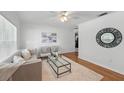 Cozy living room with hardwood floors, a ceiling fan, and neutral decor at 2915 Hargill Dr, Orlando, FL 32806