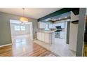 Spacious kitchen featuring tile countertops, modern appliances, and connecting living area at 2928 Ne 14Th Ave, Ocala, FL 34479