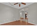 Spacious living room featuring hardwood floors, neutral paint, and an open layout at 3304 Bennington Ct, Winter Park, FL 32792
