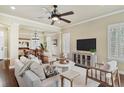 Open living room featuring a ceiling fan, neutral tones, and bright natural light at 5303 Brady Ln, Orlando, FL 32814