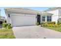 Beautiful home with brick paved driveway and attached two car garage at 5641 Oak Knoll Dr, St Cloud, FL 34771