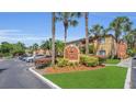 Exterior shot of Oxford Square building with trees, green grass and an Oxford Square sign at 648 Kenwick Cir # 102, Casselberry, FL 32707