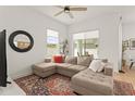 Inviting living room featuring a comfortable sectional sofa, stylish decor, and abundant natural light at 701 Dennis Ave, Orlando, FL 32807