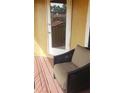 Comfortable patio chair on a wood-planked deck with view of the property and door at 706 Lighthouse Ct, Altamonte Springs, FL 32714