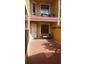 Cozy patio with brick flooring, a white entrance door and comfortable seating at 706 Lighthouse Ct, Altamonte Springs, FL 32714