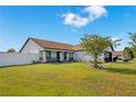 A lovely single-story home with a well-maintained yard and charming curb appeal at 2406 Placid Way, Kissimmee, FL 34758