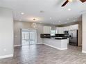 Bright, spacious kitchen with modern appliances and sliding door at 344 Buenaventura Blvd, Kissimmee, FL 34743