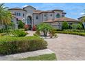 Luxury estate with manicured landscaping, circular driveway, and an attached three-car garage at 4071 Isabella Cir, Windermere, FL 34786