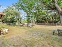 Expansive backyard featuring mature trees and ample space for outdoor activities at 4546 Malibu St, Orlando, FL 32811