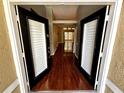 Inviting entryway featuring hardwood floors and a view of the house's interior at 563 Pleasant Grove Dr, Winter Springs, FL 32708