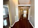 Hallway featuring hardwood floors and neutral colored walls at 563 Pleasant Grove Dr, Winter Springs, FL 32708