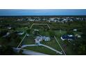 Large lot with a well-maintained home surrounded by lush vegetation and mature trees at 775 Bay Dr, New Smyrna Beach, FL 32168
