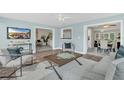 Open concept living area featuring views into the dining area and sun room at 8134 Hook Cir, Orlando, FL 32836