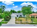 Attractive single-Gathering home with mature trees, well-manicured lawn, and attached garage in a serene setting at 840 Baybreeze Ln, Altamonte Springs, FL 32714