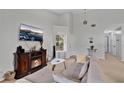 Bright and airy living room featuring a fireplace and comfortable seating at 9616 River Walk Ct, Orlando, FL 32825