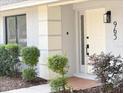 Charming home exterior featuring a well-manicured lawn, tidy landscaping, and a welcoming front entrance at 965 Brentwood Dr, Apopka, FL 32712