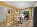 Cozy dining area with a marble-top table, adjacent to the kitchen and patio at 1074 Kensington Park Ct # 101, Altamonte Springs, FL 32714