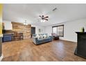 Spacious living room with hardwood flooring and large windows that flood the space with natural light at 1115 S Mary St, Eustis, FL 32726