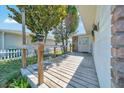 Inviting porch with wood decking, ideal for relaxing outdoors and enjoying the neighborhood's serene atmosphere at 1115 S Mary St, Eustis, FL 32726