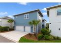 A modern two-story home with a two-car garage and meticulously landscaped front yard at 14525 Englert Aly, Orlando, FL 32827
