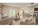 Bright and spacious living room with hardwood floors, dining area, and bar seating at 1470 Winston Rd, Maitland, FL 32751