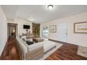 Inviting living room with hardwood floors, exposed brick, and a sliding door leading to the pool at 1470 Winston Rd, Maitland, FL 32751