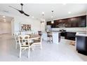 Bright kitchen features a central island, modern appliances, and a cozy dining setup at 15865 Bradicks Ct, Clermont, FL 34711