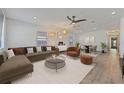 Bright, open living space featuring modern furnishings, neutral colors, and wood-look flooring at 1623 Cumbie Ave, Orlando, FL 32804