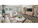 Bright living room with stylish furniture, a modern rug, and contemporary decor creating a welcoming space at 300 Avenue E Se, Winter Haven, FL 33880