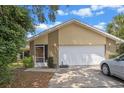 Charming single Gathering home with a two car garage and well manicured lawn and a screened in porch at 3362 Partridge St, Deltona, FL 32738