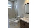 Bathroom with a modern shower-tub combination and stylish vanity at 3391 Orchid Dr, Indian Lake Estates, FL 33855
