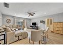 Bright living room with a large comfortable sectional couch and a sliding glass door leading to an outdoor space at 4306 Lake Underhill Rd # C, Orlando, FL 32803