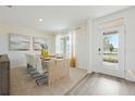 Dining room features a stylish dining table with white chairs, decorative wallpaper, and large windows at 510 Coronado Cove Rd, New Smyrna Beach, FL 32168