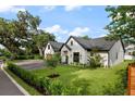 Beautiful single-Gathering house with a well-manicured green lawn and mature trees in a peaceful setting at 5237 Haverill Dr, Orlando, FL 32809