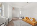 Bright play room with plush yellow seating and modern flooring at 5700 Iron Brand Rd, St Cloud, FL 34771