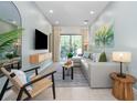 Bright living room boasts a sectional sofa, modern decor, and access to the outdoor space at 10251 Ebb Tide Ln, Orlando, FL 32821