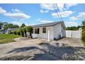 This single-story home features an oversized driveway and easy access to the fenced backyard at 1216 Floral Way, Apopka, FL 32703