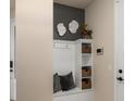 Welcoming entryway with custom storage and seating is conveniently situated for organization at 13551 Pearl Beach St, Winter Garden, FL 34787