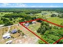 Expansive property with a charming home, sparkling pool, and lush greenery, fully fenced for privacy and security at 1508 Lake Mills Rd, Chuluota, FL 32766