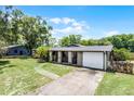 Charming single-story home with stone accents and a two car garage on a large lawn at 1508 Lake Mills Rd, Chuluota, FL 32766